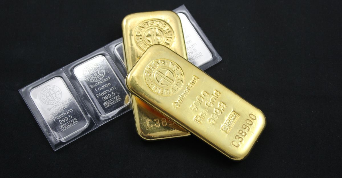 Goudstaven op een financiële markt achtergrond